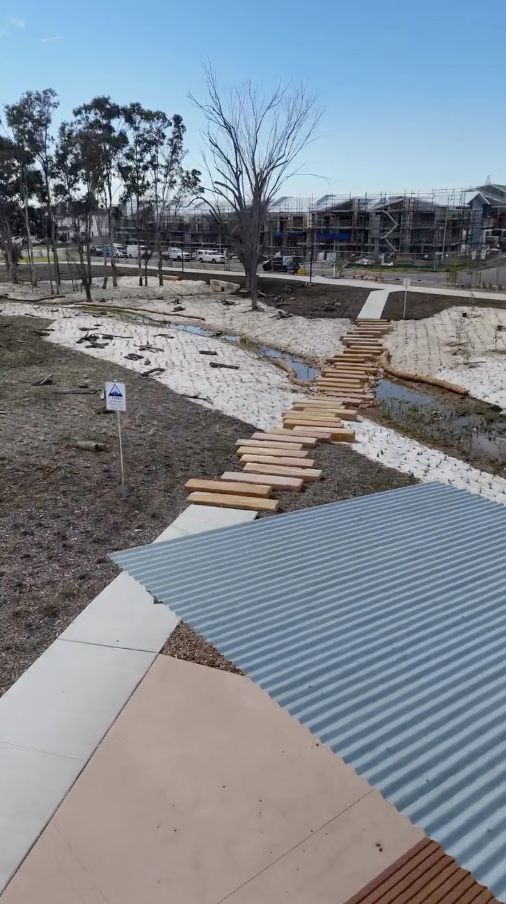 Creek-line revegetation with stepping stones and stabilised batters on a NSW development